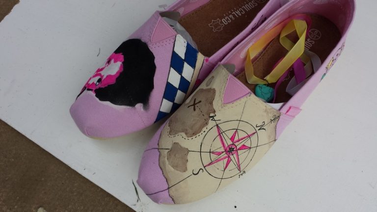 pink toms with a stencil portrait and and aged map design