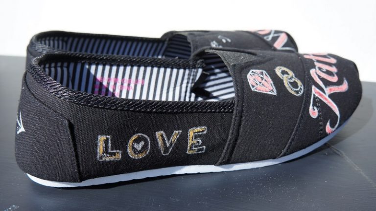 Black toms with the word "Love" written on the side
