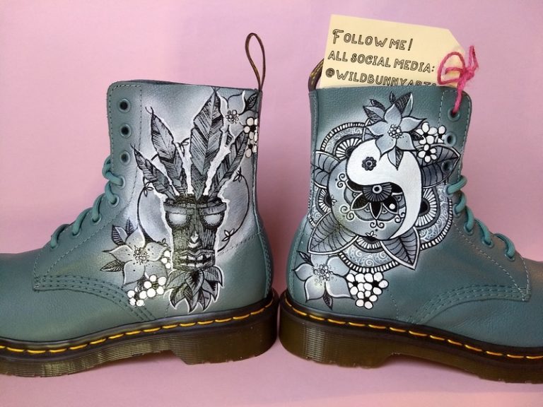 picture of some grey blue doc martens with a crash bandicoot and henna style yin yang style design